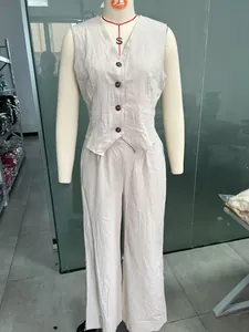 Two-piece linen cotton set with button-down vest and wide-leg trousers in beige color