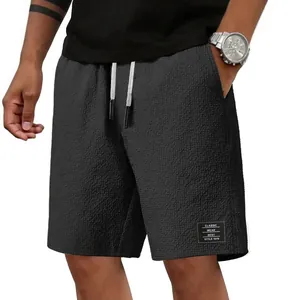 Herren-Freizeitshorts aus Waffelstrick in Dunkelgrau mit Kordelzug und Logo-Patch