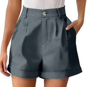 Detail view of high-waisted grey cotton linen shorts with front button and pockets