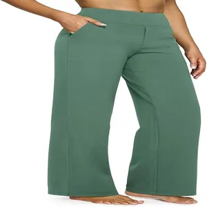 Dettaglio pantaloni casual da donna verdi a vita alta e gamba larga con ampie tasche