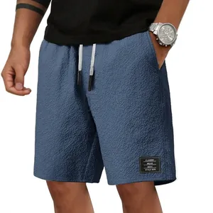 Herren blaue Waffelstrick-Freizeit-Strandshorts mit elastischem Bund und Kordelzug