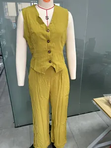 Fashionable mustard yellow cotton linen vest and wide-leg trousers set shown on a mannequin