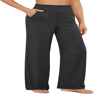 Vista dettagliata dei pantaloni a gamba larga a vita alta con tasche laterali grigi.