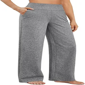 Dettaglio ravvicinato dei pantaloni yoga grigi mélange a gamba larga per donna.