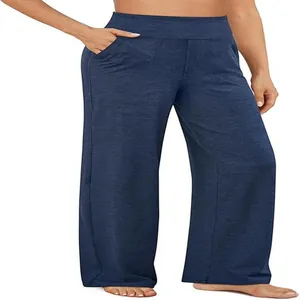 Dettaglio dei pantaloni casual blu scuro a vita alta con gamba larga e tasche laterali