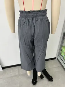 Back view detail of grey high-waisted wide-leg linen casual pants on a mannequin