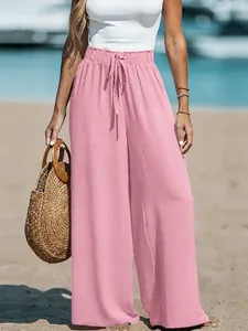 Detailed view of pink cotton linen wide leg pants showing the drawstring waist design