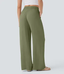 Back view detail of women's olive green high-waisted wide-leg linen pants with side pockets