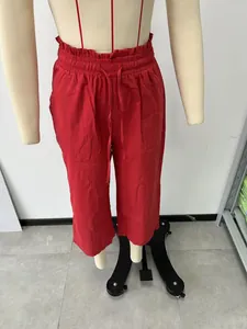 Red high-waisted linen casual pants for women with drawstring waist shown on a mannequin