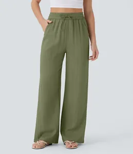 Detail of high waist drawstring wide leg linen pants with side pockets in olive green