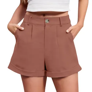 Detail view of high-waisted cotton linen shorts in terracotta with button detail