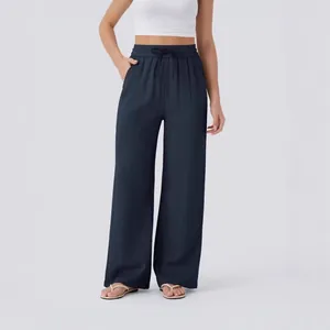 High-waisted drawstring wide-leg linen pants with side pockets for summer beach wear.