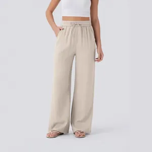 High waisted drawstring wide leg linen trousers for women in beige beach casual style