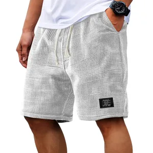 Casual men's waffle knit shorts featuring breathable fabric and loose fit design
