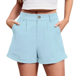 Detailed view of light blue high-waisted cotton linen shorts with button and pleats
