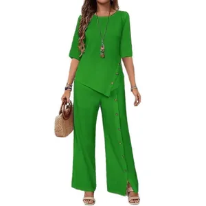Vibrant green two-piece set featuring irregular hem top and buttoned wide-leg pants.