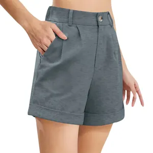 Close-up detail of women's grey high-waisted cotton linen shorts with front pleats