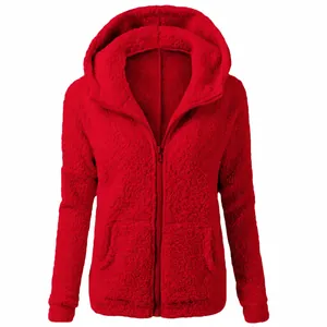 Close-up view of red fuzzy plush hoodie with full-front zipper and cozy texture