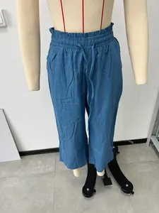 Detailed view of women's blue high-waist wide-leg linen pants with elastic drawstring waist