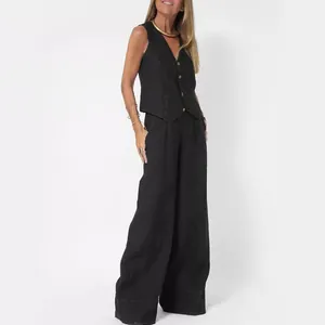 Elegant black cotton linen two-piece set featuring a tailored vest and wide-leg trousers