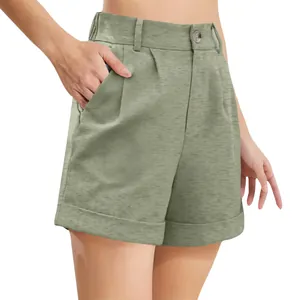 Macro view of olive green high-waisted cotton linen shorts showing button detail