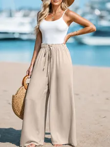 Women's casual cotton linen wide leg pants with drawstring waist in beach setting