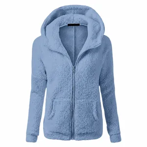 Detail of the soft sherpa texture on this light blue hooded jacket with a metal zipper.