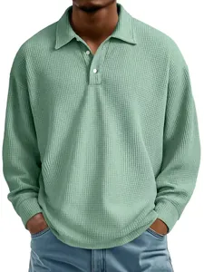 Close-up of mint green waffle knit long sleeve polo shirt for men's casual wear