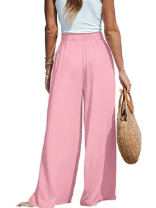Back view of pink high-waisted wide-leg linen trousers for women