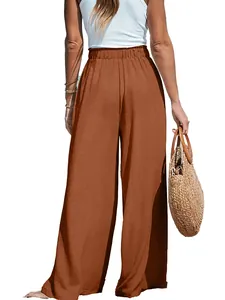Detailed back view of high-waisted breathable cotton linen wide-leg trousers in terracotta