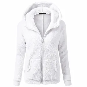 Detail of white plush fleece texture and zipper on women's hooded jacket