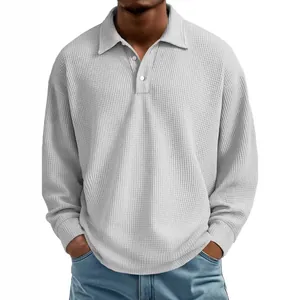 Grey waffle knit long-sleeved polo shirt for men featuring a classic collar and buttons.