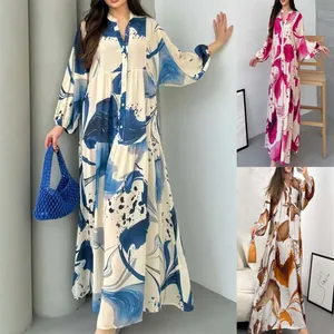 V-neck long sleeve printed maxi dresses in blue, pink, and gold abstract patterns displayed.