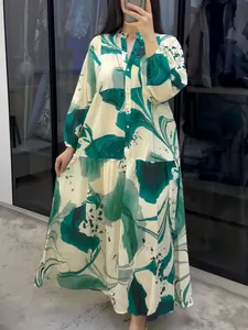 Loose long-sleeved V-neck maxi dress with vibrant green abstract floral print details