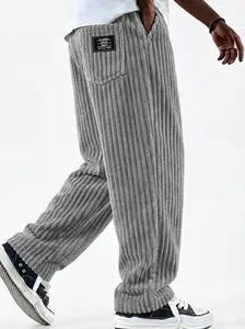 Close-up of gray corduroy pants showing textured fabric and back pocket detail.