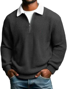 Close-up of men's waffle texture polo shirt with contrast collar and zipper detail.