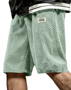 Detailed macro view of men's waffle textured jacquard shorts in mint green fabric