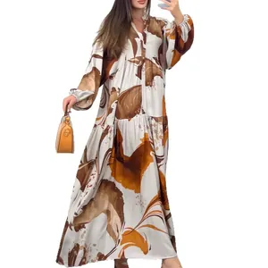 Elegant abstract print maxi dress with v-neck and long sleeves for a stylish casual look