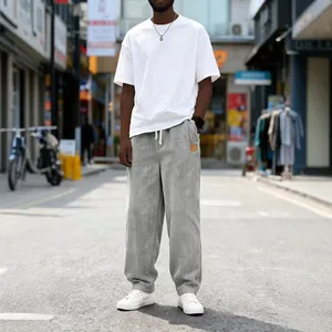 Men's grey corduroy casual pants with drawstring waist and loose straight fit for urban style