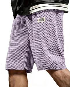 Detail view of light purple men's jacquard plaid casual shorts with textured fabric
