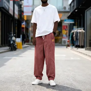 Men's loose fit corduroy pants in dusty rose with drawstring waist and pocket detail