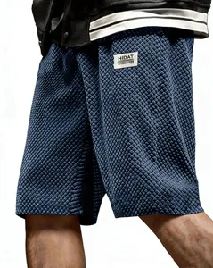 Men's navy blue casual shorts with textured jacquard lattice pattern and side pockets.