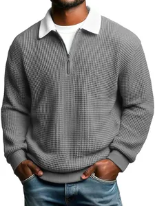 Detail of gray waffle knit long sleeve polo with white contrast collar and quarter-zip