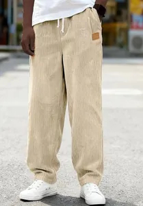 Beige corduroy pants detail showcasing high quality fabric and drawstring waist