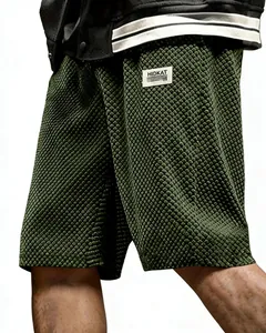 Detail view of men's olive green textured jacquard casual shorts in loose fit