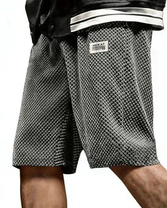 Close-up detail of grey men's jacquard plaid casual shorts showing textured fabric