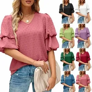Collection of women's V-neck swiss dot tiered lantern sleeve blouses in multiple colors