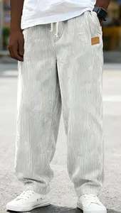 Detailed view of mens white corduroy drawstring pants with relaxed straight leg fit.