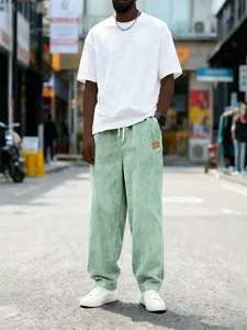 Loose fit light green corduroy trousers for men with drawstring waist and side pockets