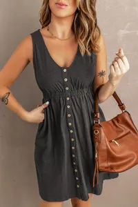 Detailed view of women's sleeveless charcoal grey V-neck dress with wooden button details.